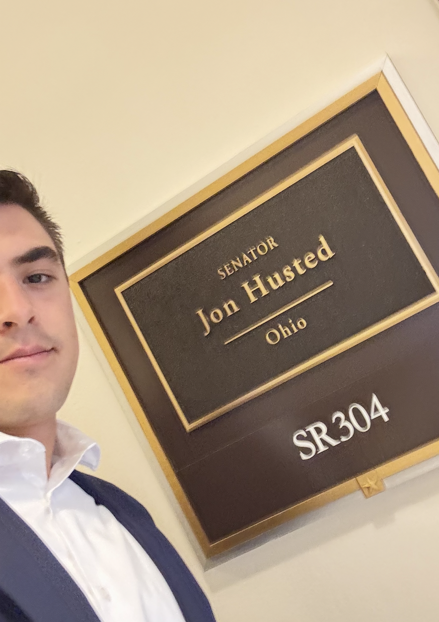 Mitch selfie by Sen Husted sign.
