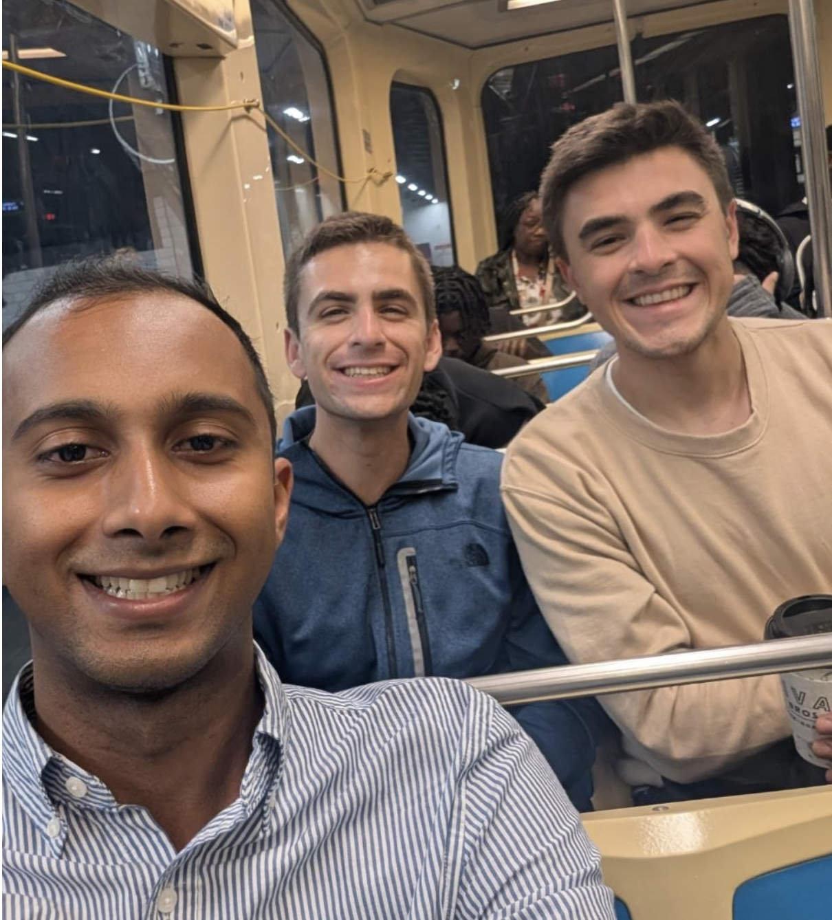 3 young men on a trolley